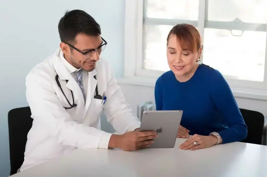 Healthcare provider explaining treatment and HFD financing options to patient